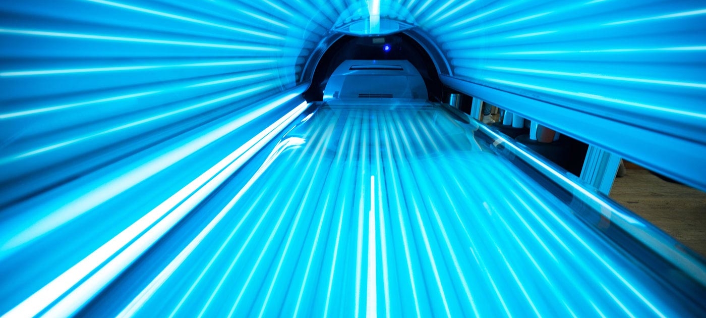 Blue-lit tanning bed